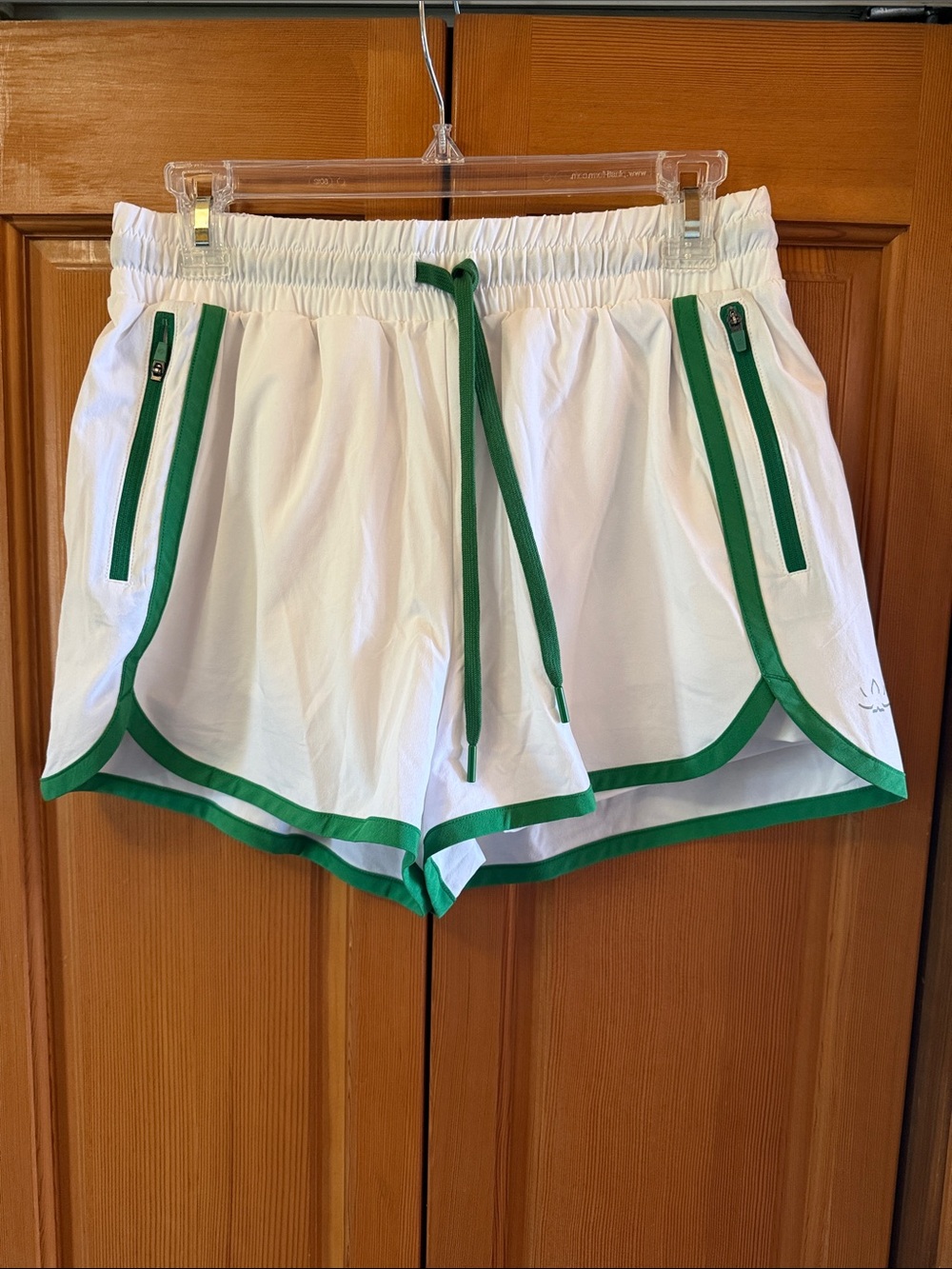 Beyond yoga Women’s White Athletic Shorts with Green Trim